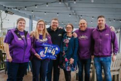 Forever Stars representatives in group photo wearing charity branded tops